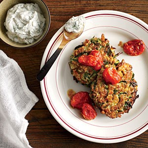 Zucchini-farro cakes with herbed goat cheese and slow-roasted tomatoes