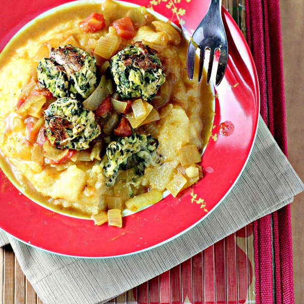 Zucchini "meatballs" and curry-tomato sauce over polenta